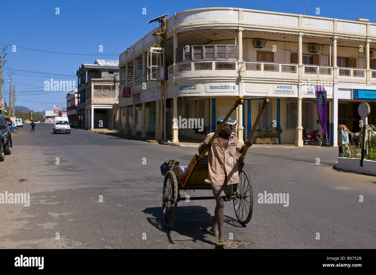 Man with his rickshaw in Diego Suarez (Antsiranana), Madagascar, Africa Stock Photo