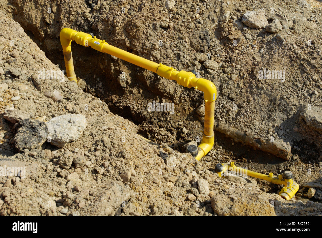 Water pipes exposed from underground Stock Photo Alamy