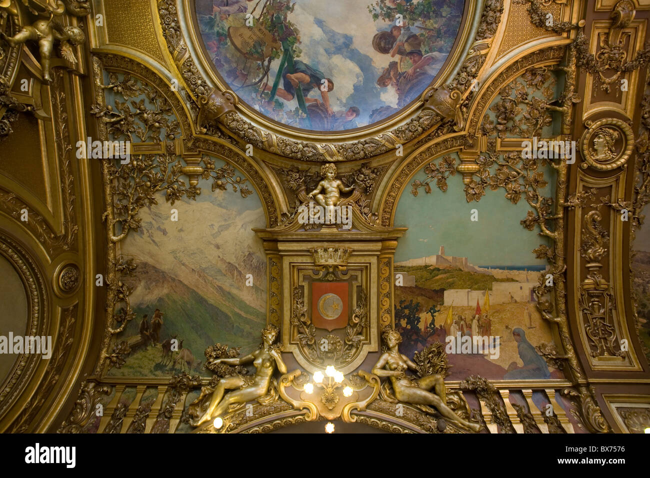 elaborate ceiling at le train bleu restaurant in the gare de lyon Stock Photo