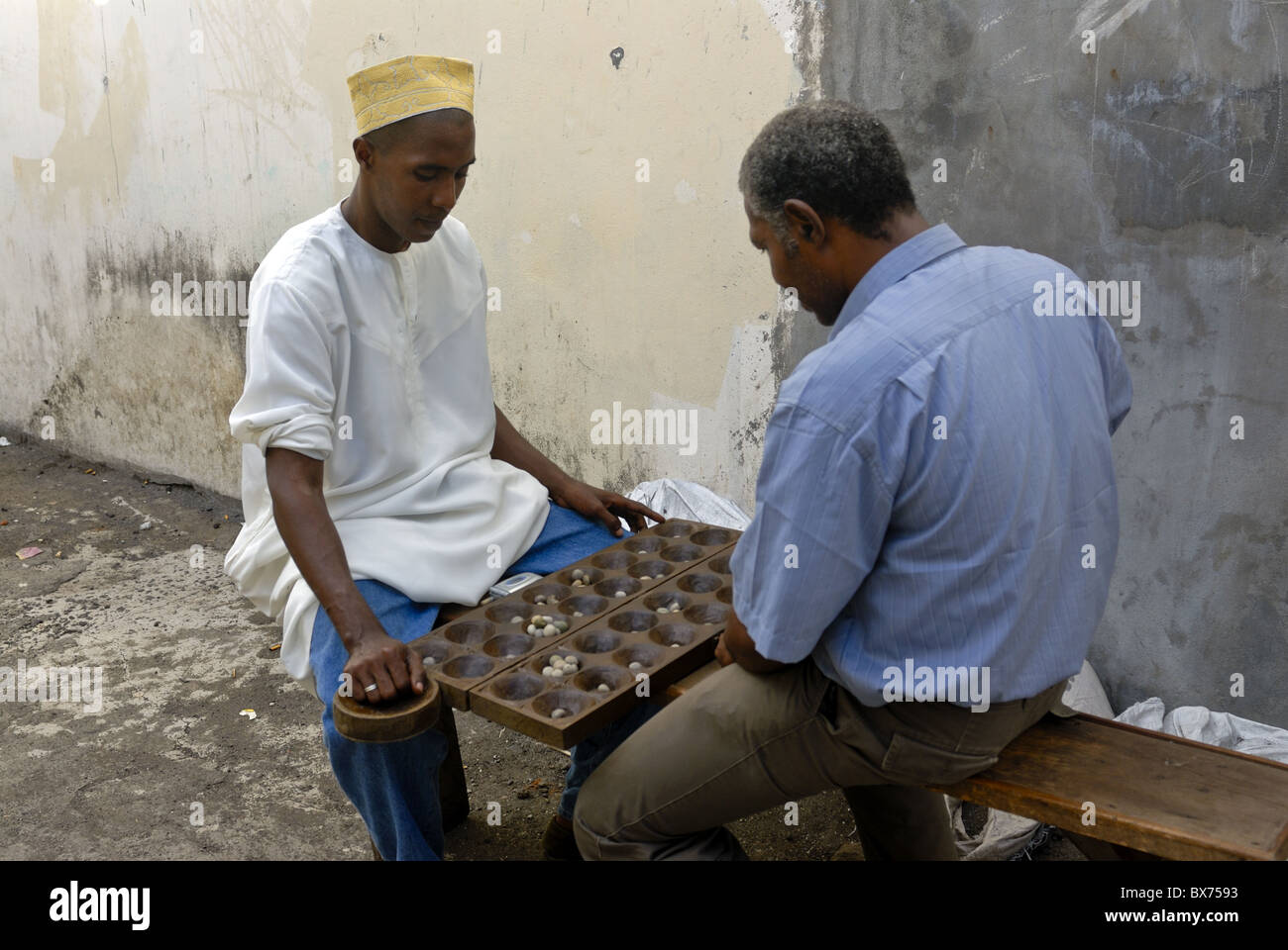 Men playing Kalah (Kalaha) (Mancala), a game in the mancala family, Moroni, Grand Comore, Comores, Indian Ocean, Africa Stock Photo