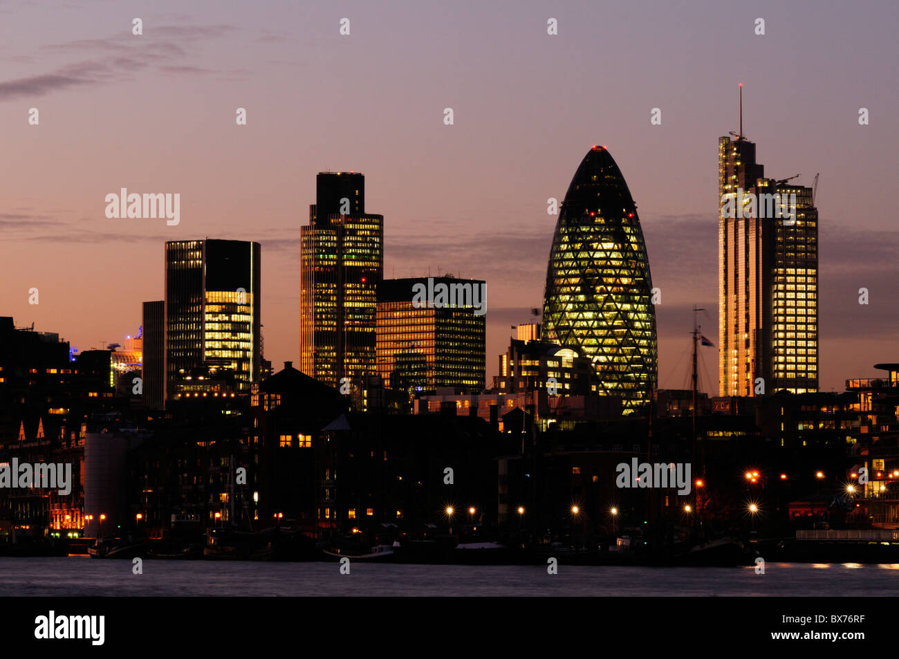 City of London Skyline at Night including Tower 42, 30 St Mary Axe and Heron Tower from Bermondsey,  London, England, UK Stock Photo