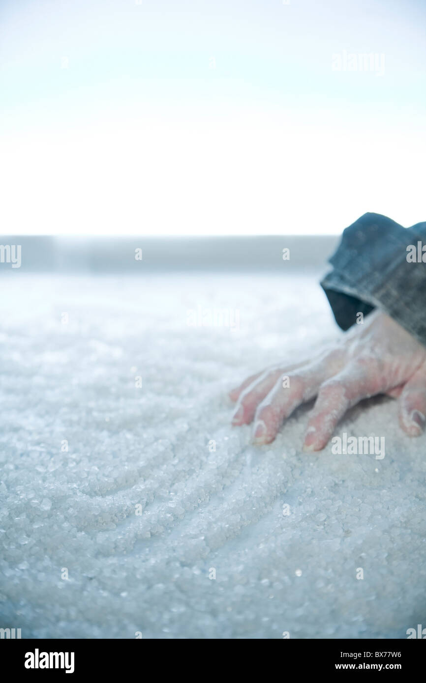 frozen hand lying on snow and ice. exterior location, Stock Photo