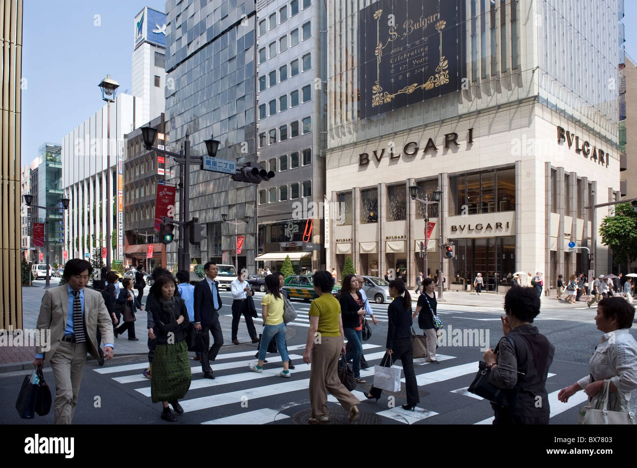 Shoppers strolling along Chuo-dori Street in the affluent Ginza retail and entertainment district in Tokyo, Japan, Asia Stock Photo