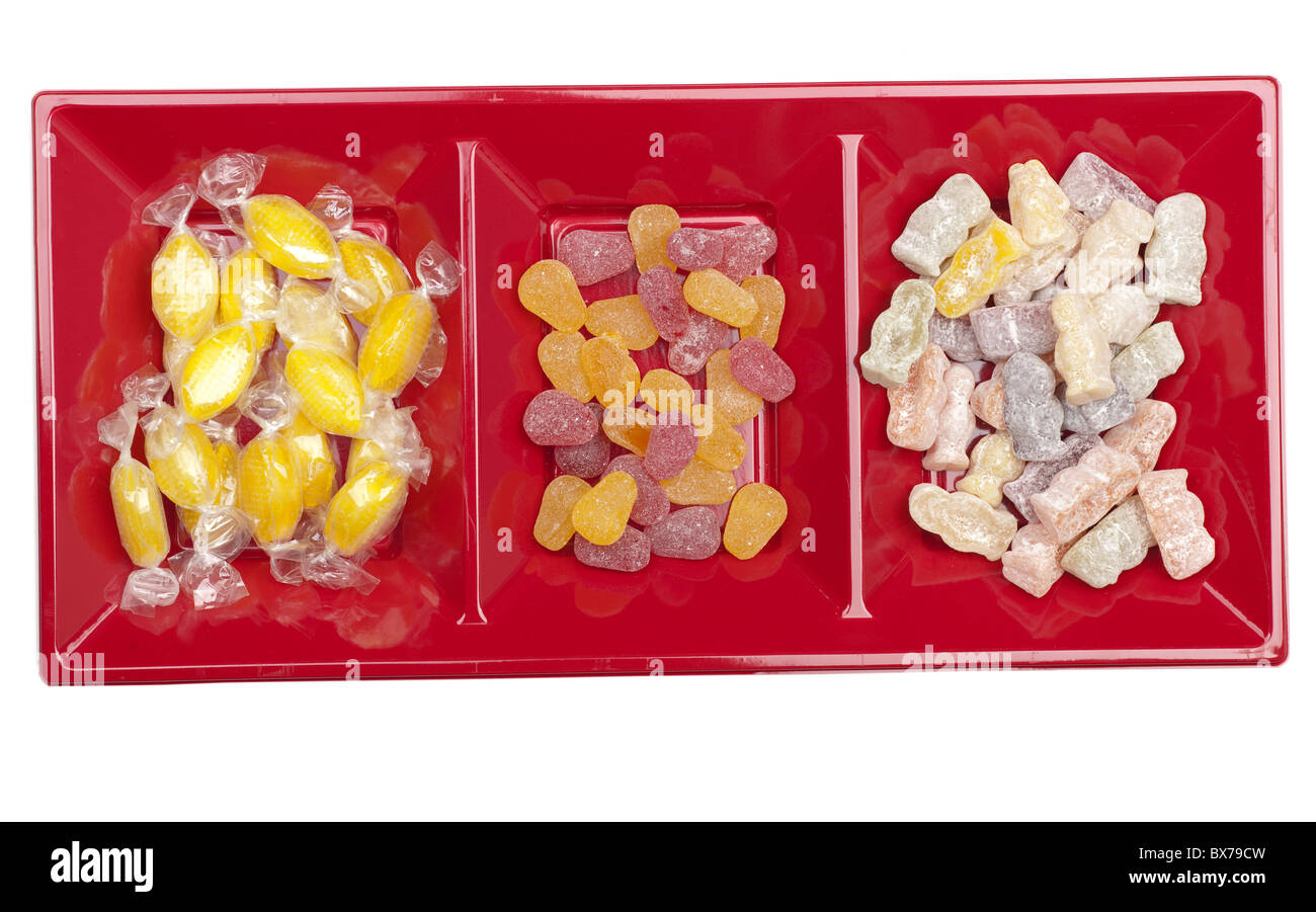 Three compartment red server dish full of sweets Stock Photo - Alamy
