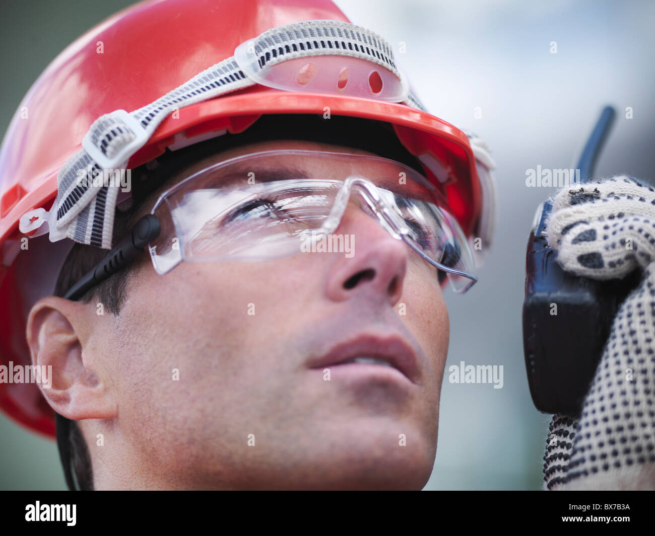 Worker with industrial plant reflections Stock Photo