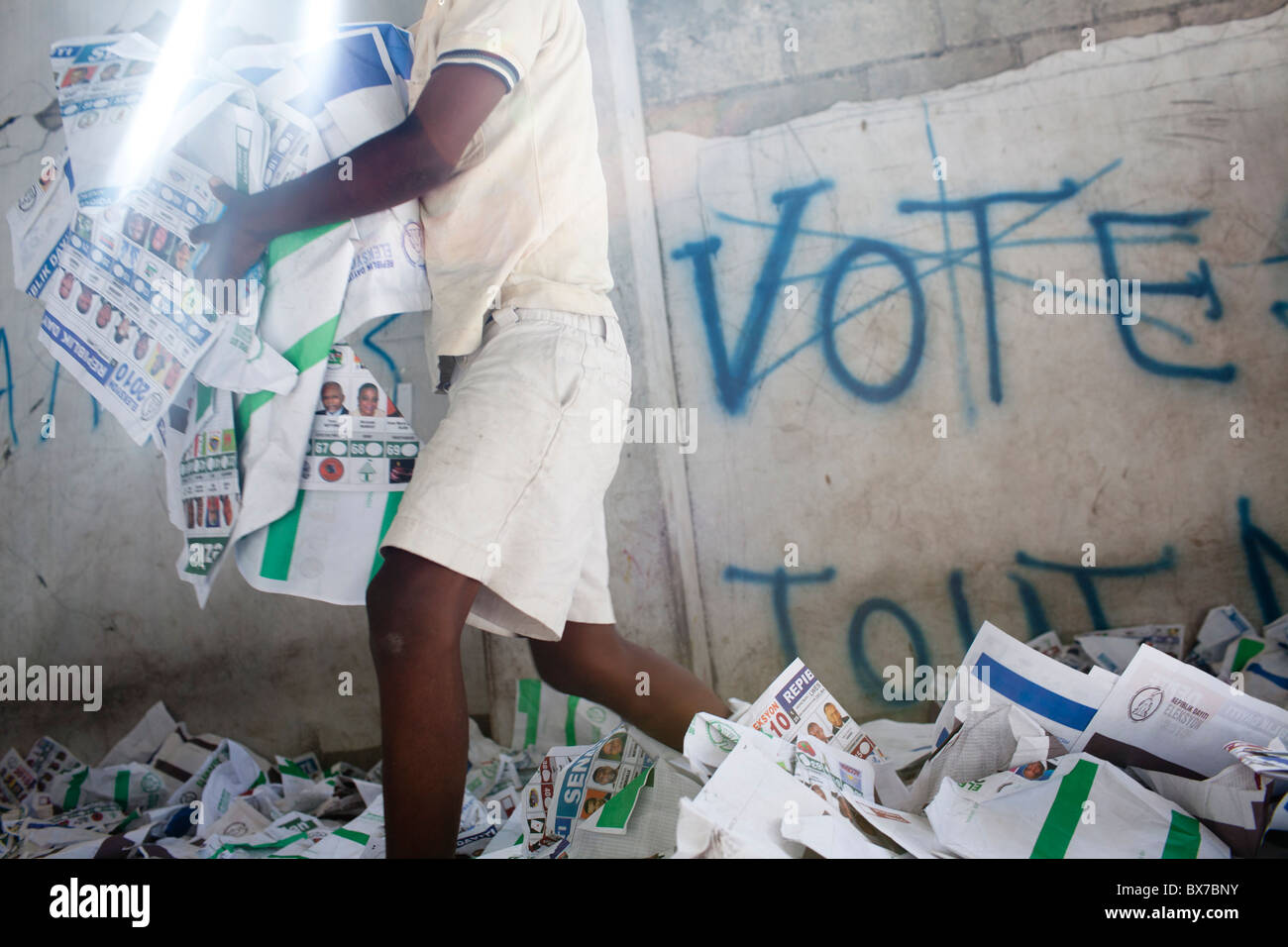 Children play in ballots at a polling station that had been ransacked on the previous day during presidential elections Stock Photo