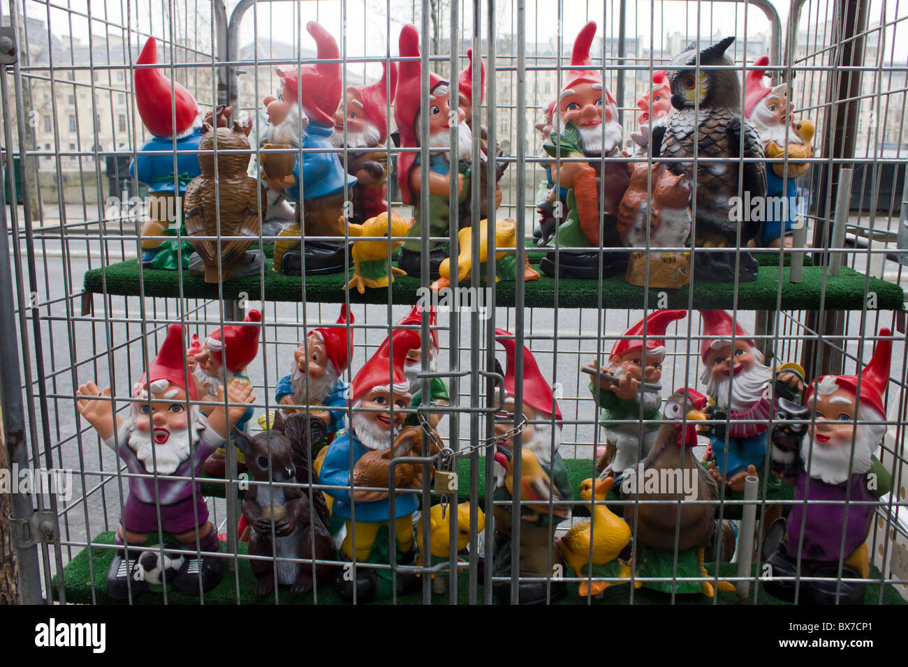 garden gnomes for sale in cage Stock Photo