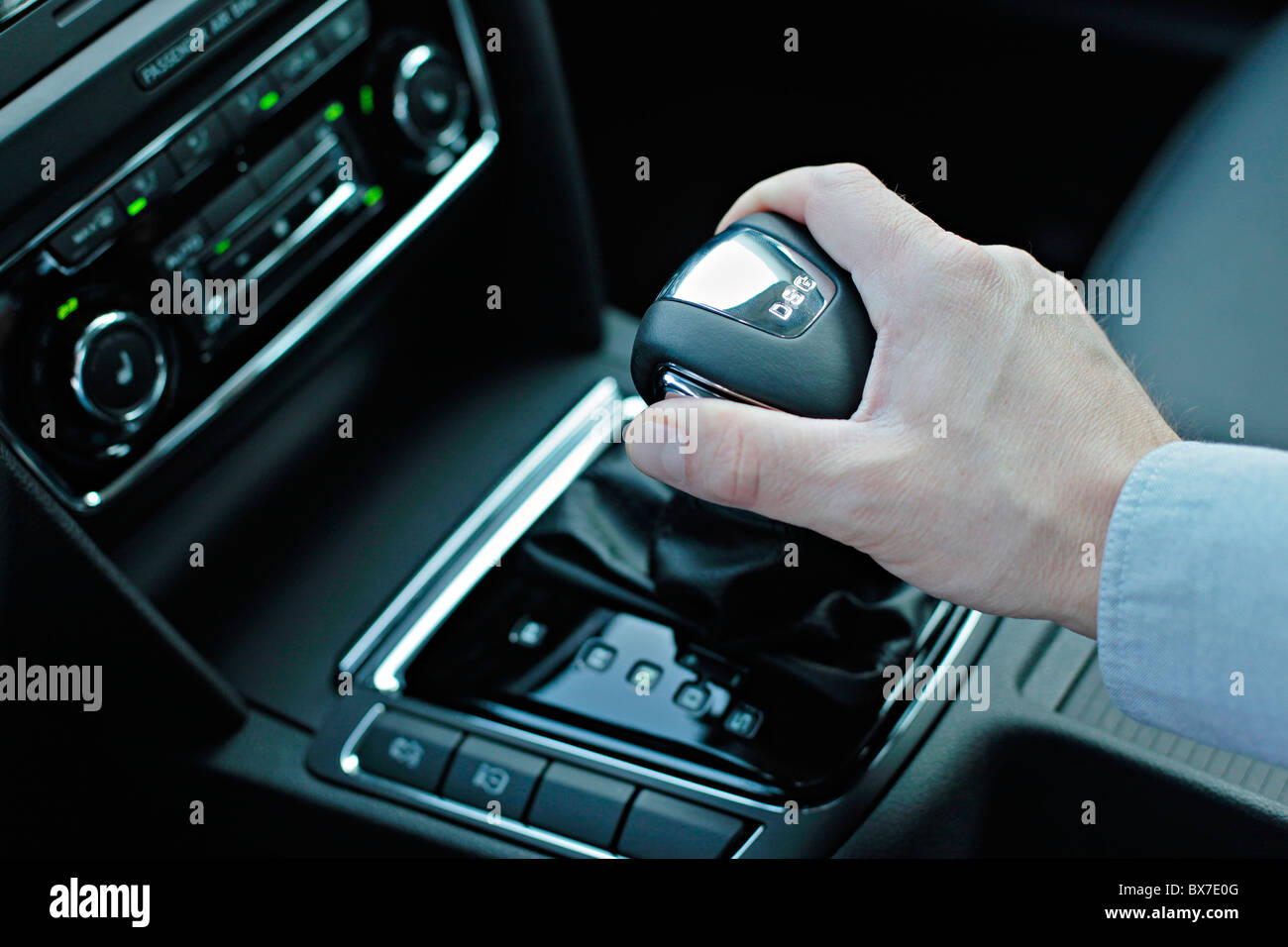 Man hand on an automatic gear stick, lever, gear box DSG, luxury passenger  car, Skoda Superb Combi, air-conditioning Stock Photo - Alamy