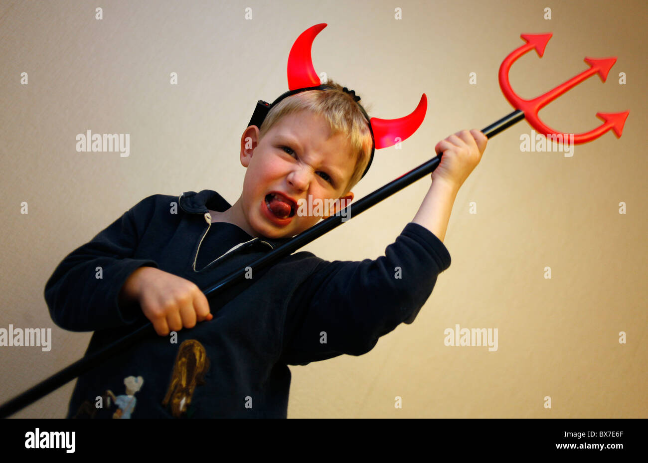 Child, boy, devil, horns, trident, pitchfork, fork Stock Photo Alamy
