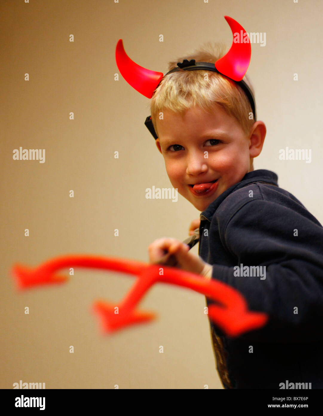 Child, boy, devil, horns, trident, pitchfork, fork Stock Photo Alamy