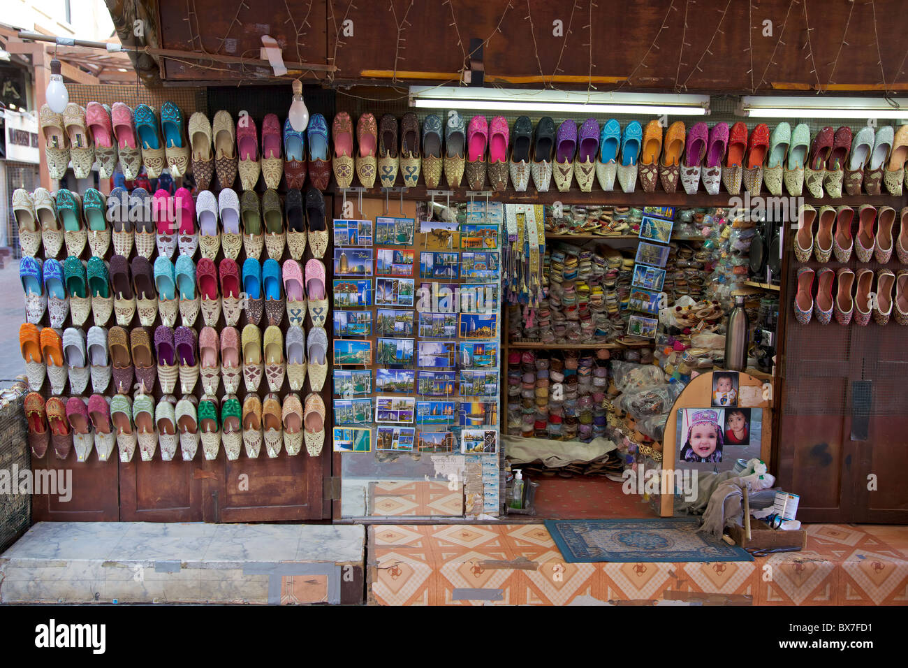 Arabian shoes on sale in a traditional souk in old Dubai, UAE Stock