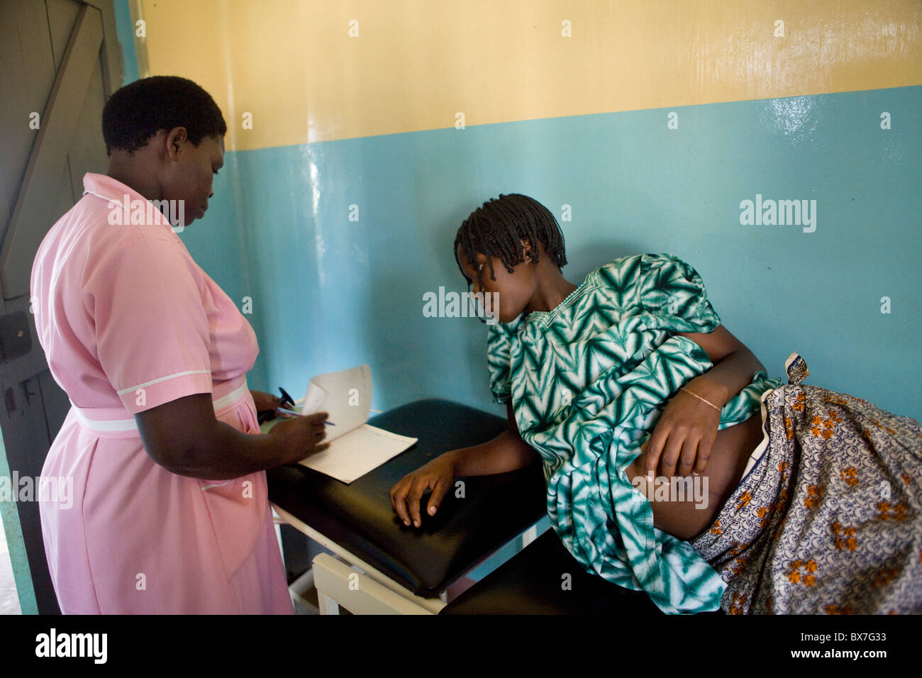 A pregnant woman receives a maternal exam in hospital in Amuria Stock ...