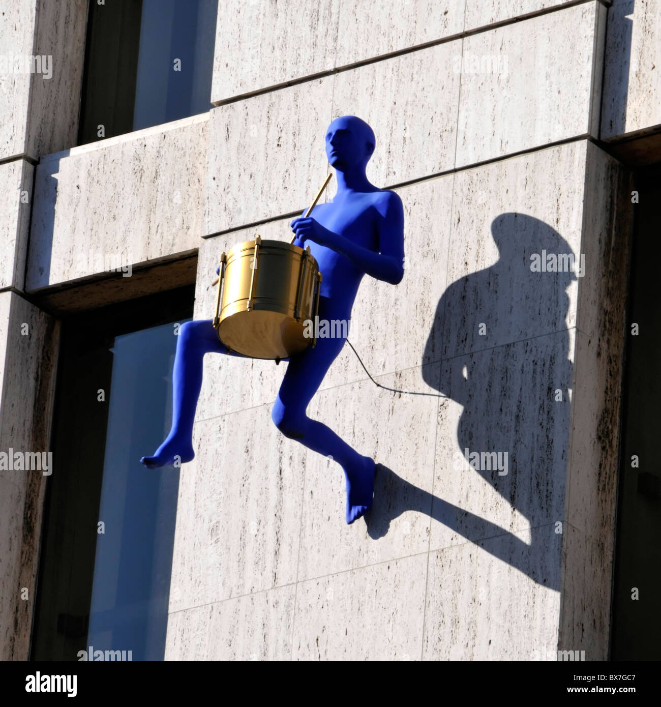 Part of the 'Blue Men' art installation by Ofra Zimbalista on an office building wall Stock Photo