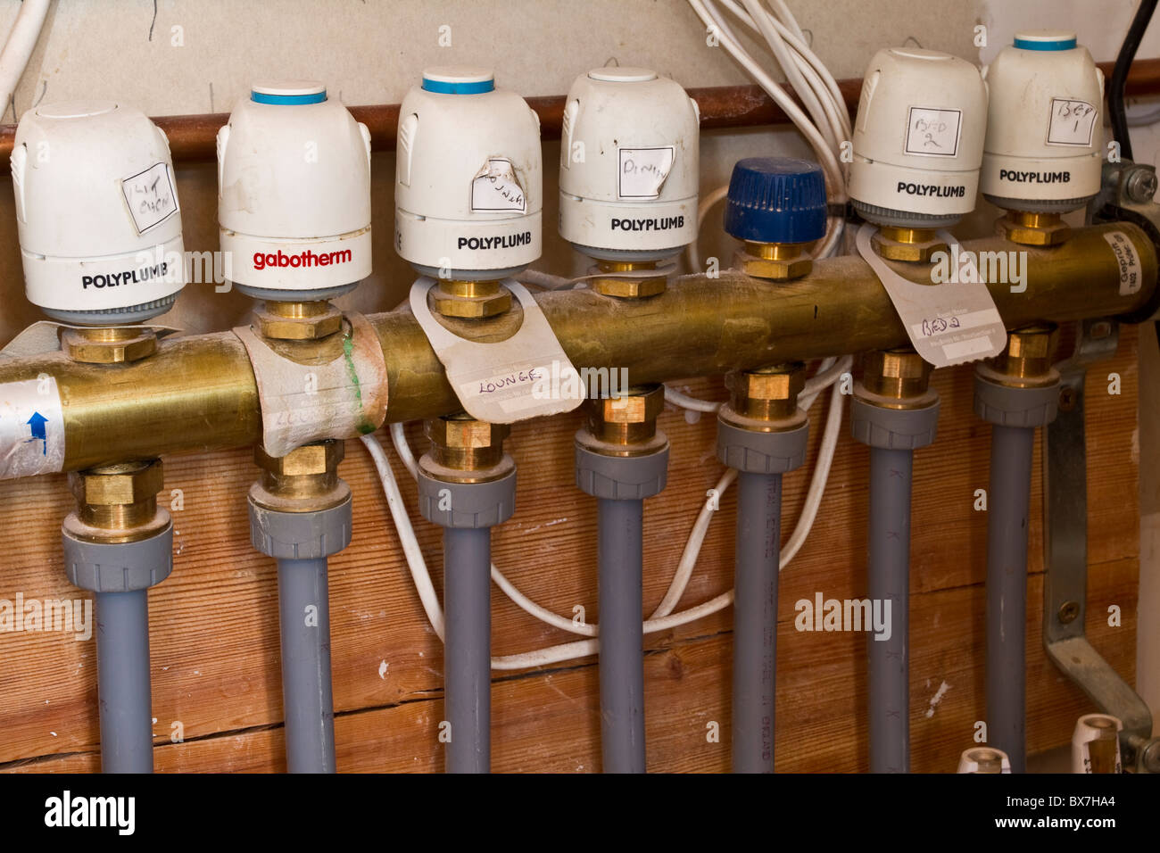 Underfloor Central Heating pipes underfloor installation, Control Valves,  pump layout systems, Insulated new plumbling pipework Stock Photo - Alamy