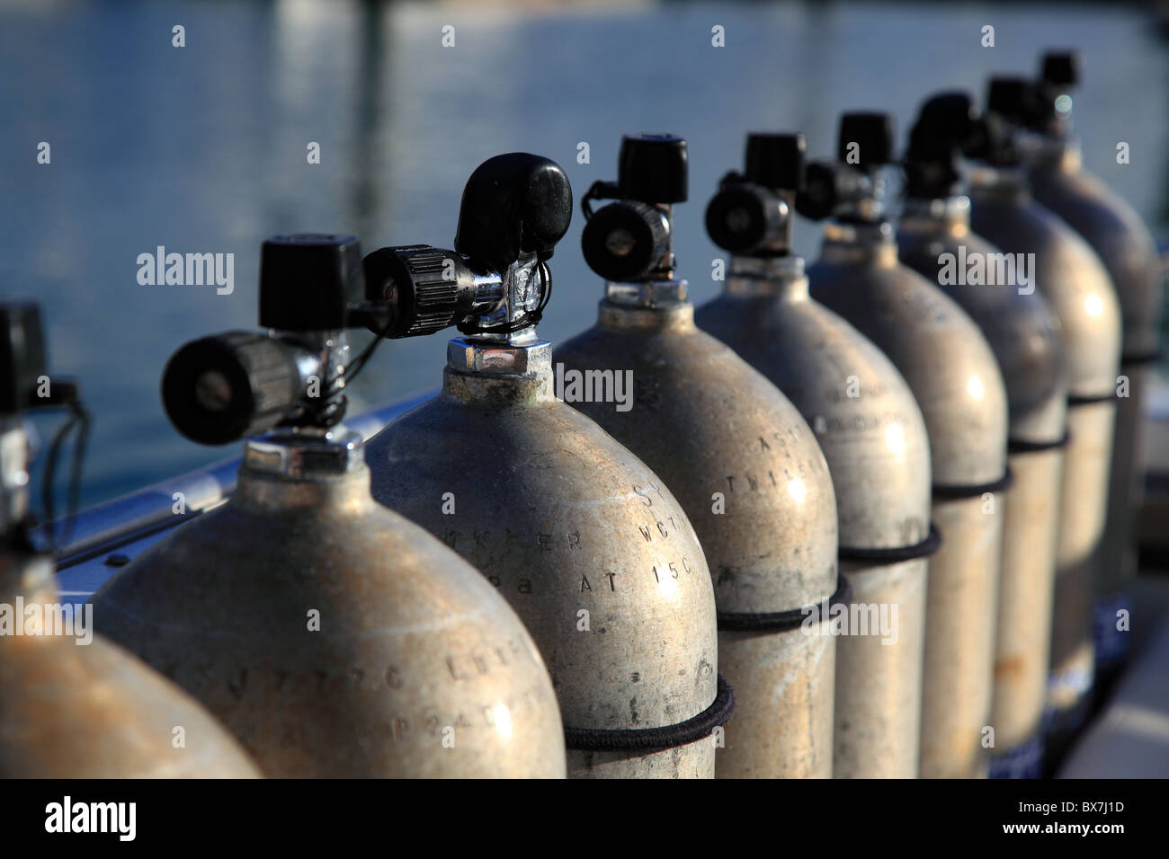 Row of compressed air tanks like they are used during a diving trip. Stock Photo