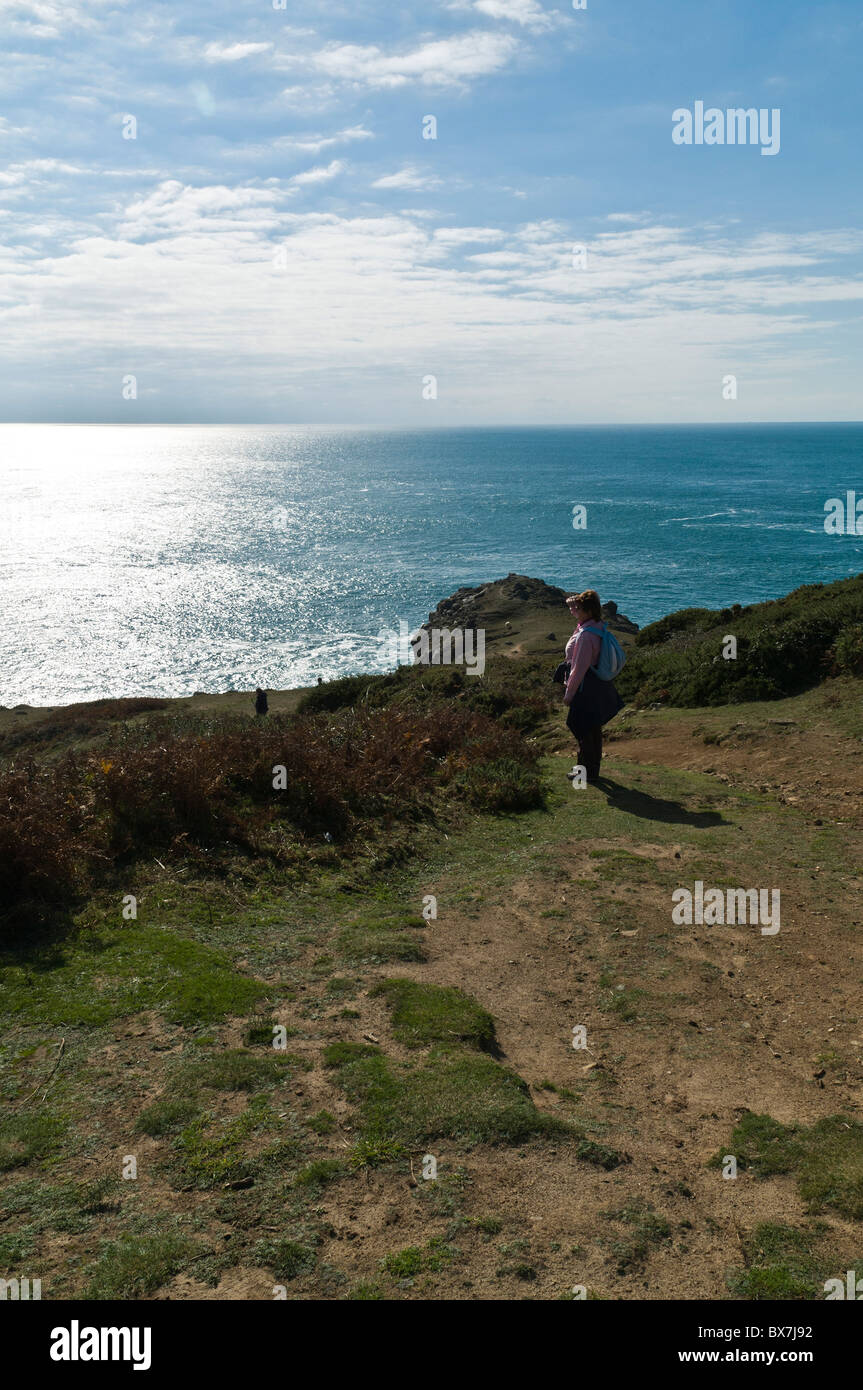 dh  LITTLE SARK SARK ISLAND Woman tourist looking out to sea Stock Photo