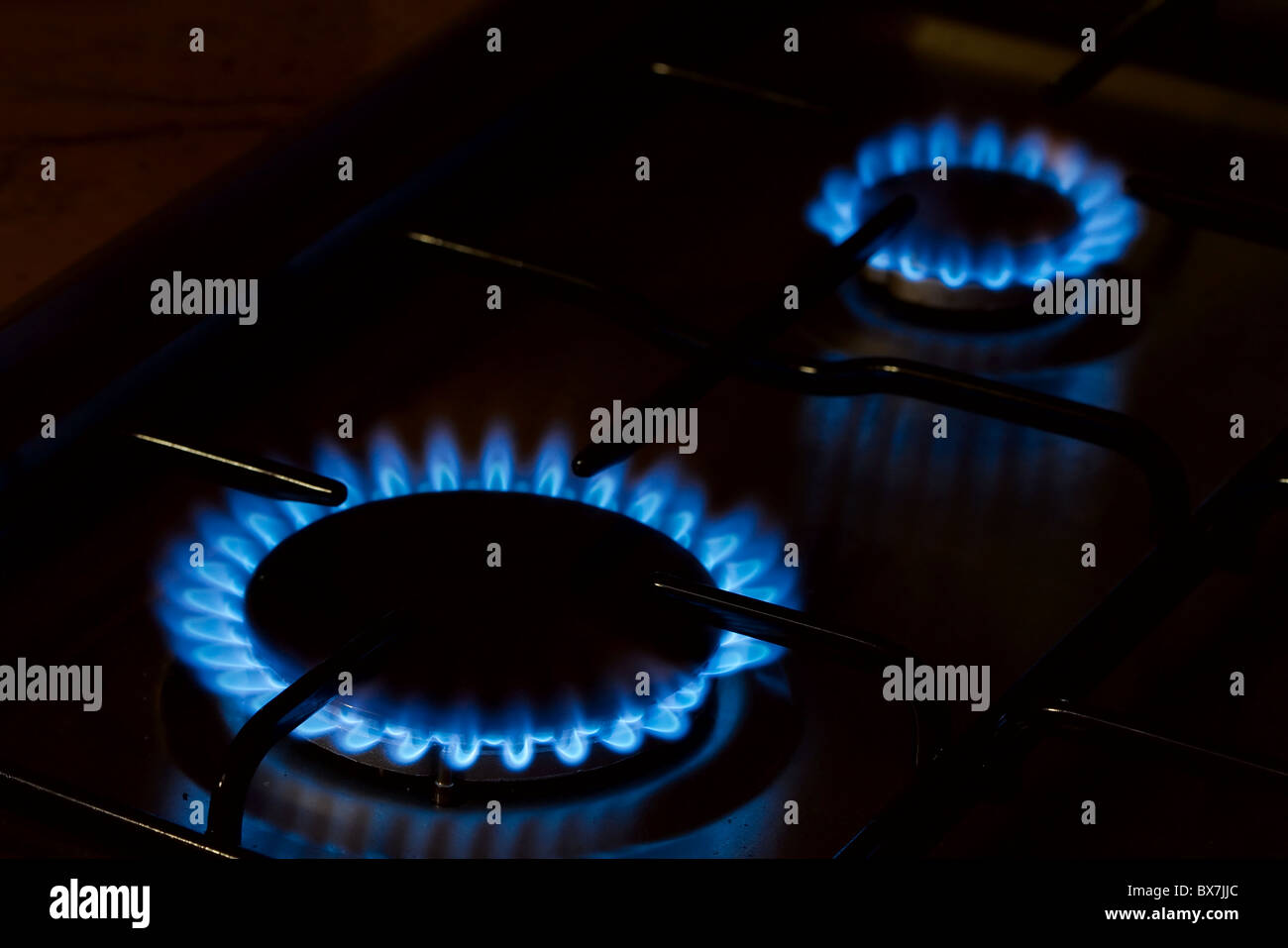 Cooking oven gas flame in the dark Stock Photo