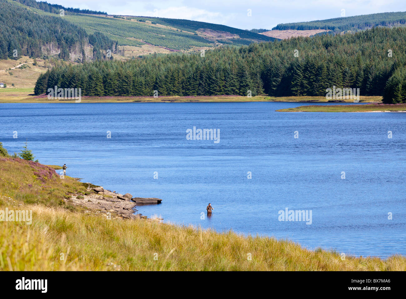 Fishermen fly fishing for trout in Lussa Loch on the Kintyre Peninsula. Argyll & Bute, Scotland Stock Photo