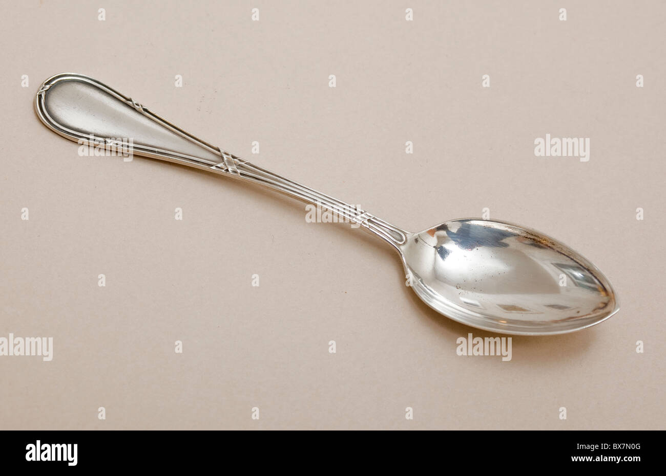 An antique silver Italian teaspoon, Stock Photo