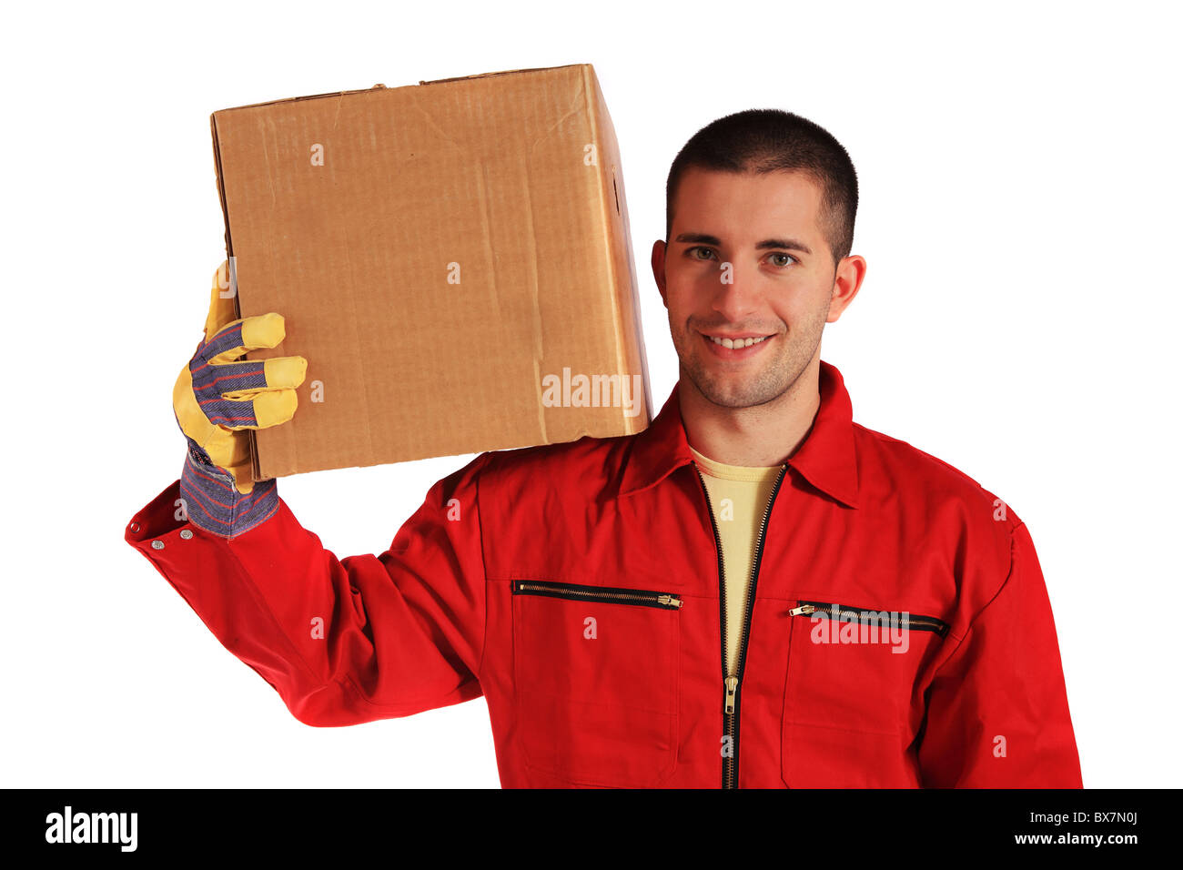Motivated worker of an moving company in red overall. All on white background. Stock Photo