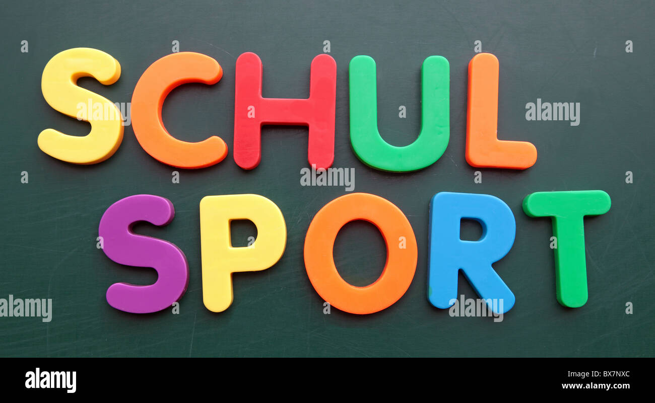 The german term for school sport in colored letters on a blackboard. Stock Photo