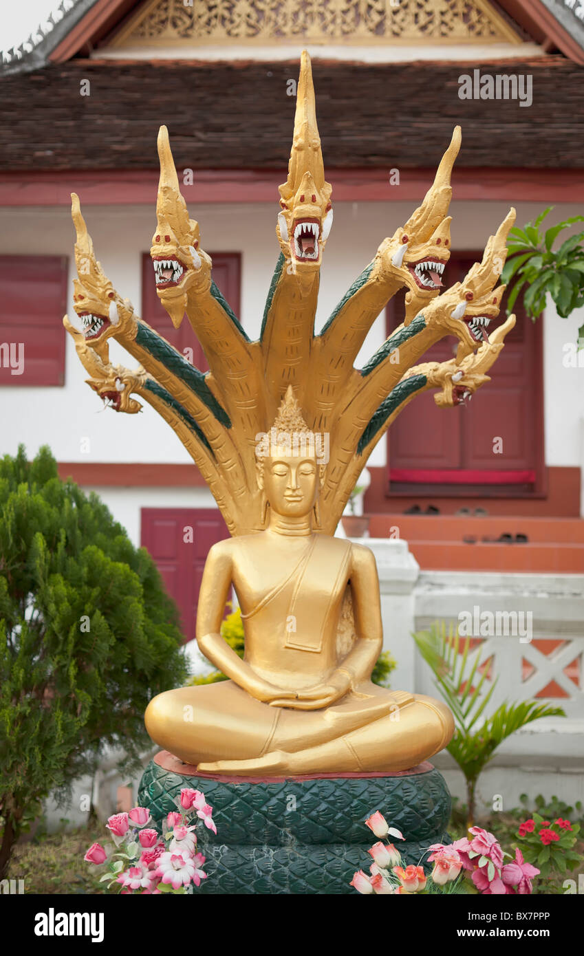 Sitting Buddha statue at Wat Mai Suwannaphumaham, Luang Prabang, Laos. Stock Photo