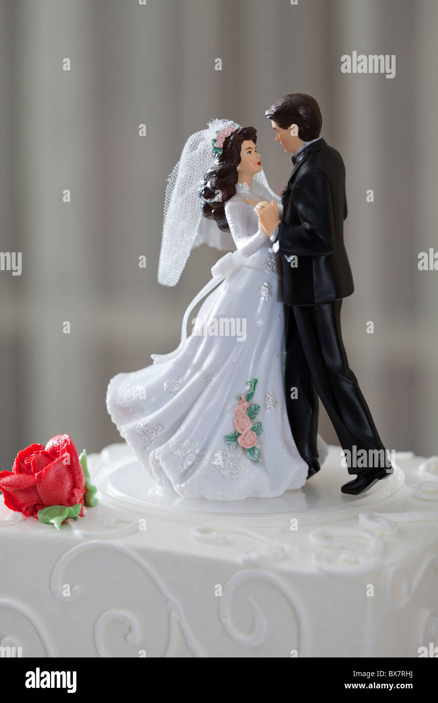 Wedding cake and topper with couple dancing Stock Photo