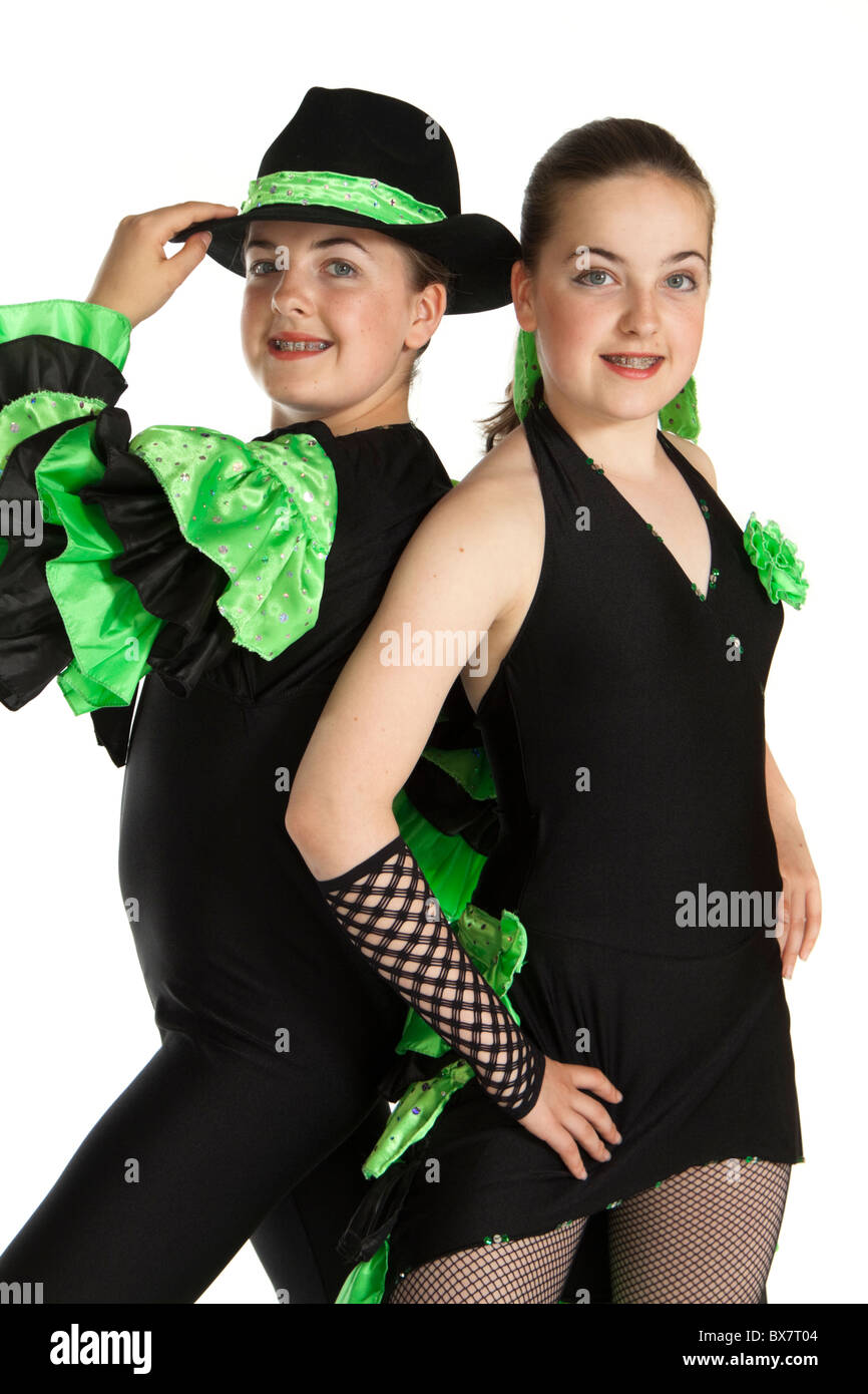 Studio shot of beautiful young identical twins in colourful modern / jazz dancing costume Stock Photo