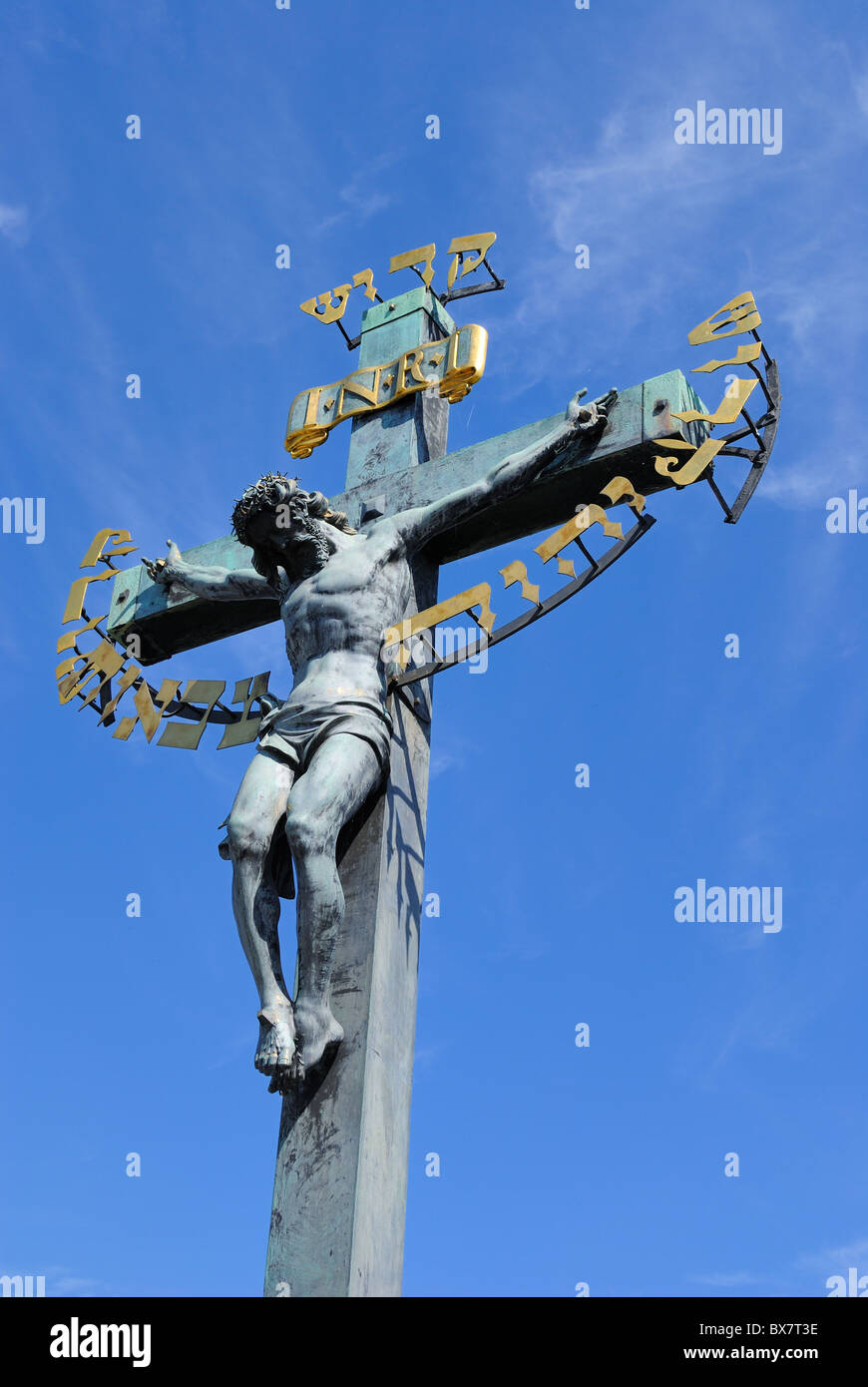 Crucfix and calvary on Charles Bridge in Prague, Czech Republic Stock Photo