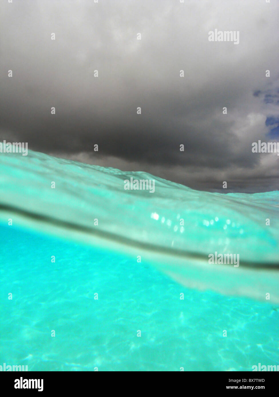 Crystalline lagoon waters and monsoon clouds over Cocos Keeling atoll, Indian Ocean Stock Photo