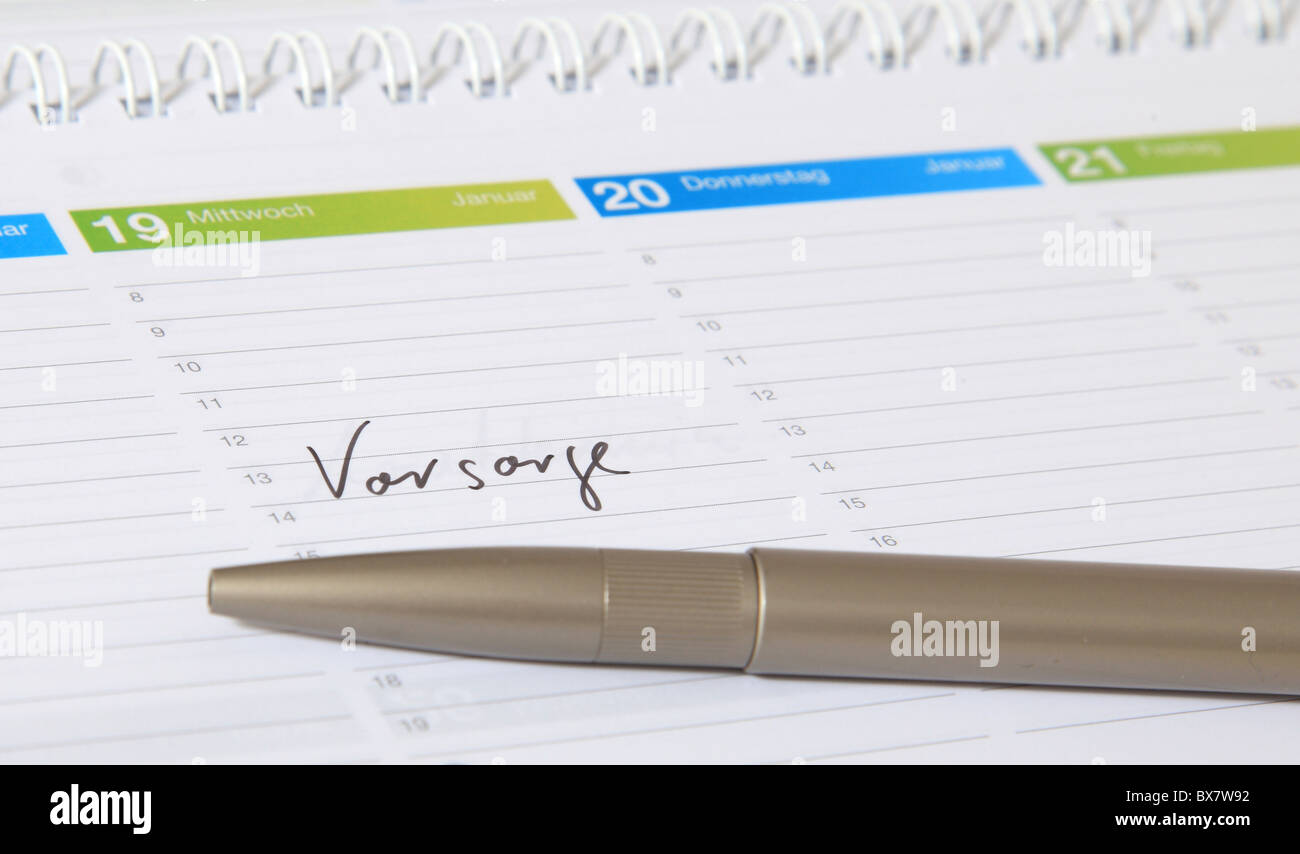 A calendar showing the german term Vorwarnung. english translation: precaution Stock Photo