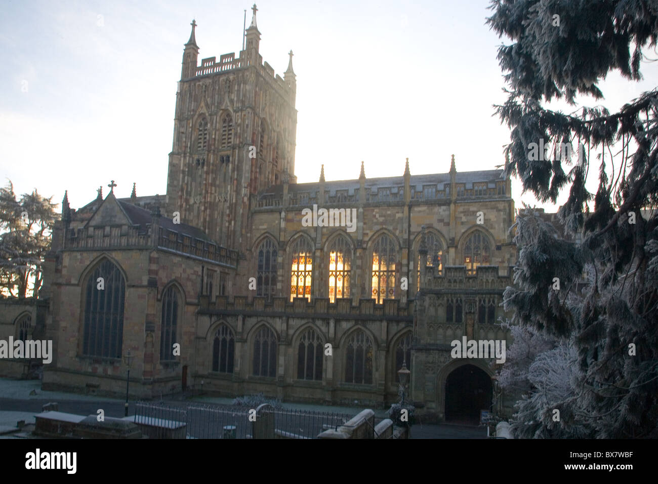 Great Malvern Priory Church, Worcestershire, UK, with morning sun shining through the windows on a wintry day Stock Photo