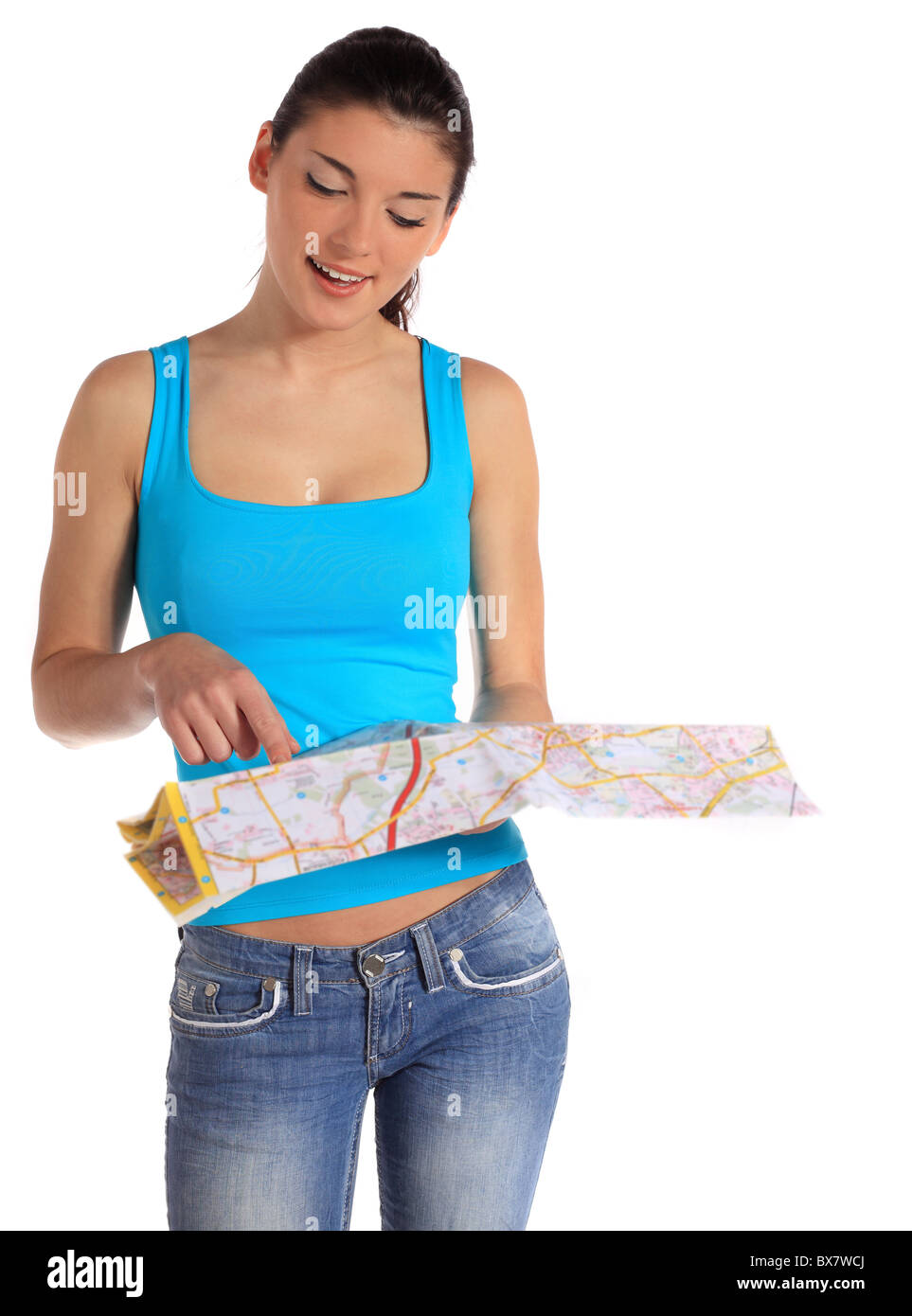 Attractive young woman looking at a map. All on white background. Stock Photo