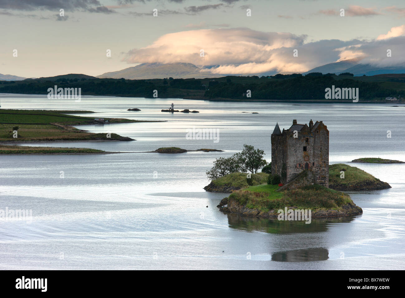 Daybreak on Castle Stalker and the mountains of Mull, Appin, Argyll, western Scotland Stock Photo