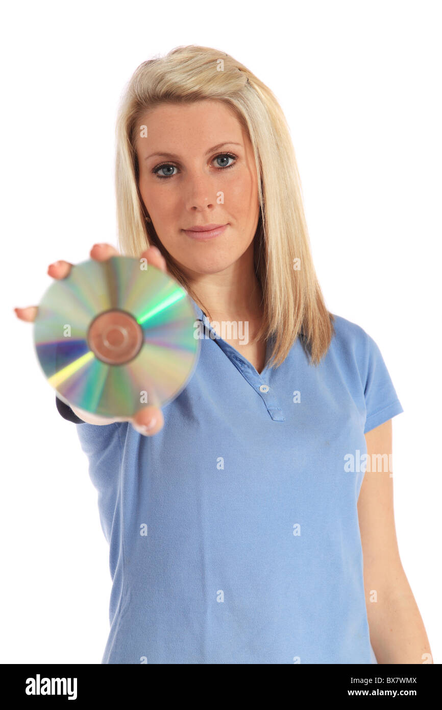 An attractive young woman holding a DVD. All on white background. Stock Photo
