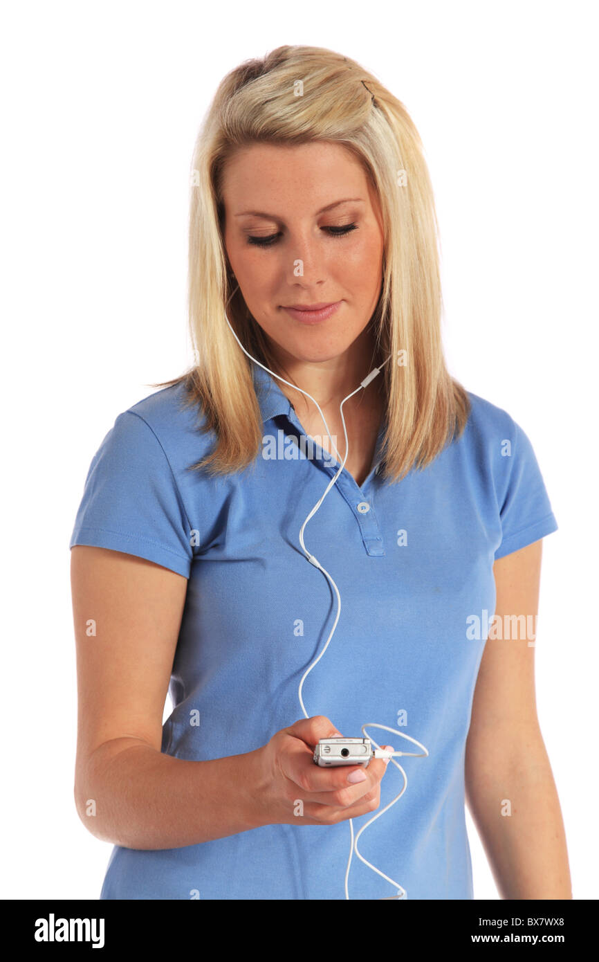Attractive young woman listening to some music. All on white background. Stock Photo