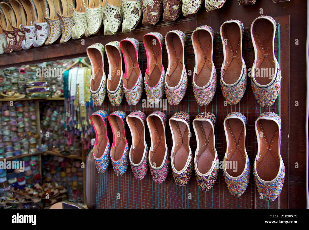 Arabian shoes on sale in a traditional souk in old Dubai, UAE Stock