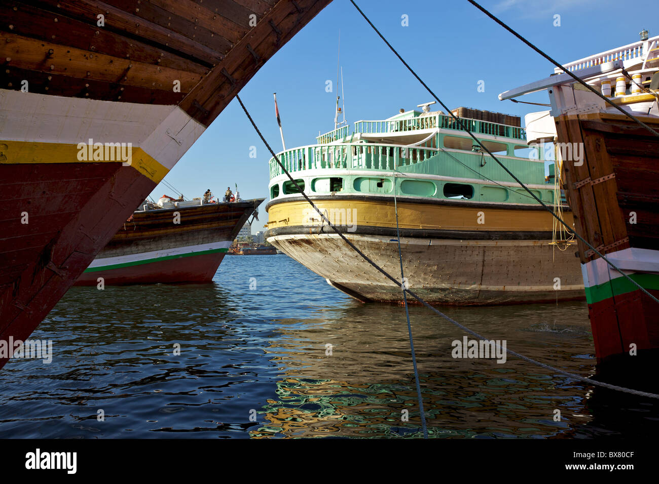 Traditional wooden trading dhows moored in Dubai Creek, UAE. Stock Photo