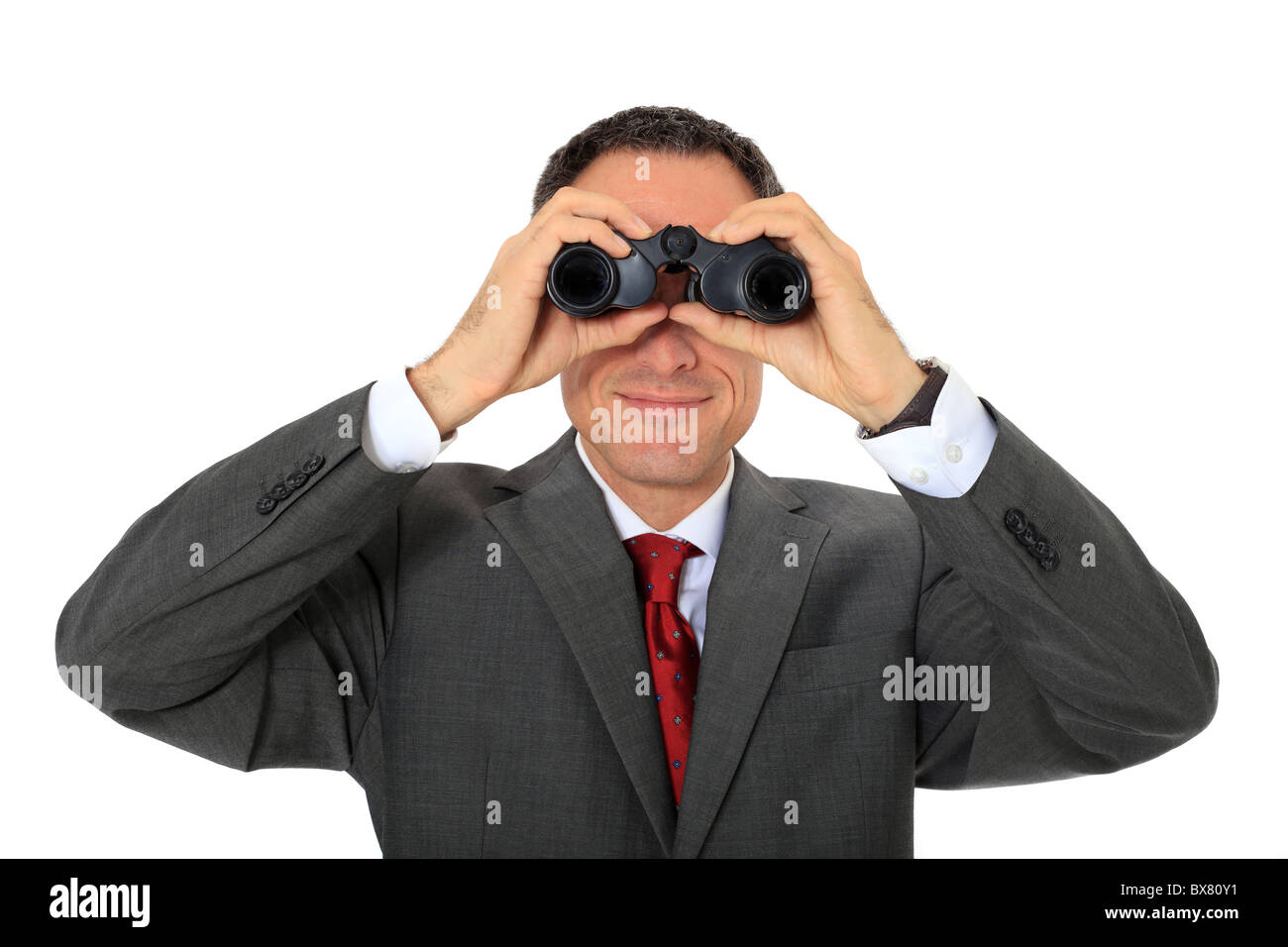 Attractive businessman using spyglass. All on white background. Stock Photo