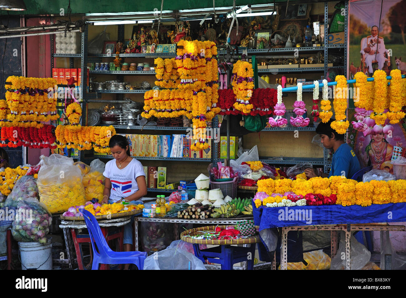 Garlands of flowers for sale, Silom, Bang Rak District, Bangkok, Thailand Stock Photo