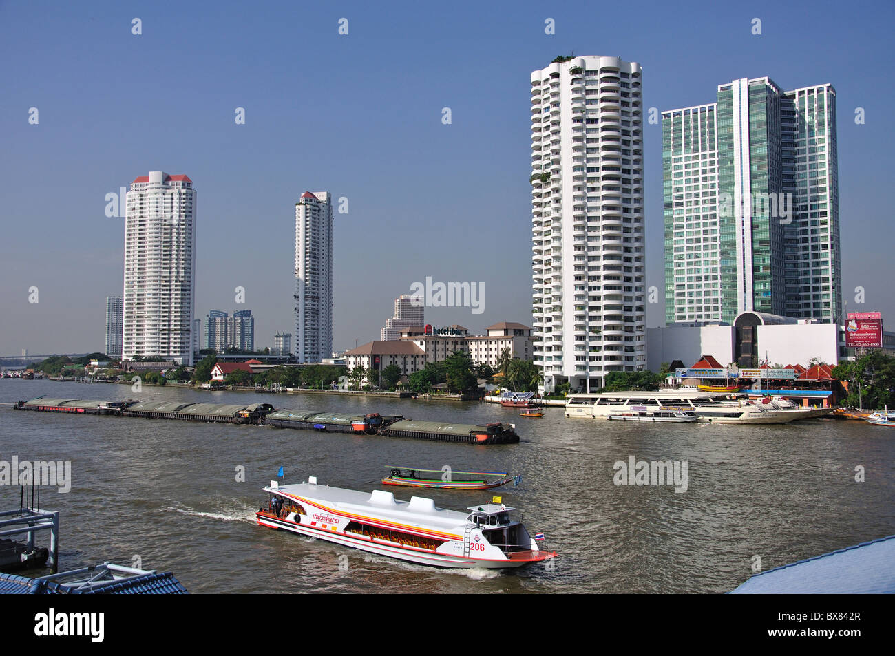 River boats on Chao Phraya River from Bang Rak District, Bangkok, Thailand Stock Photo