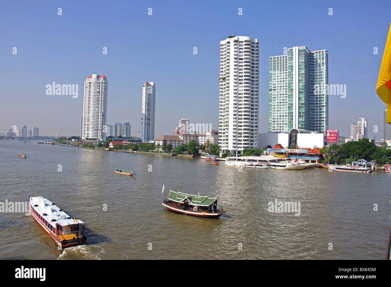 River boats on Chao Phraya River, Bang Rak District, Bangkok, Thailand Stock Photo