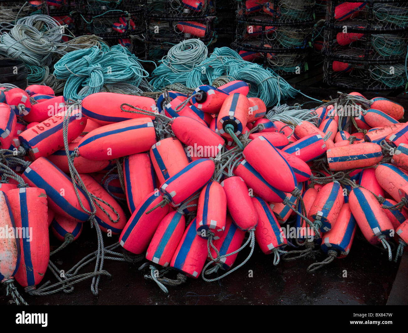 Piles of colorful buoys, crab pots, and ropes on the Oregon coast. Stock Photo
