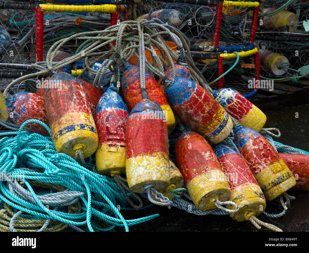 Piles of colorful buoys, crab pots, and ropes on the Oregon coast. Stock Photo