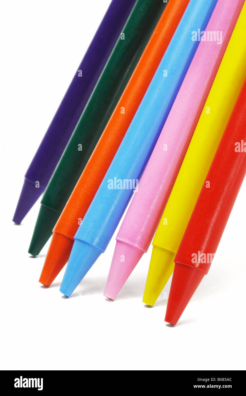 Close up of colorful crayon pencils standing on white background Stock Photo