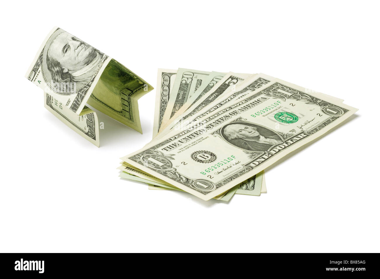 Money house and US dollars on white background Stock Photo