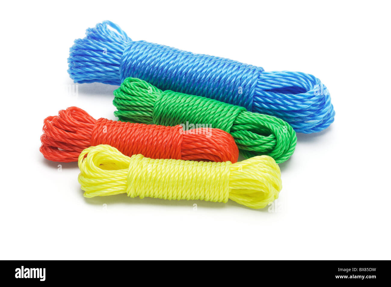Bundles of colorful nylon ropes on white background Stock Photo