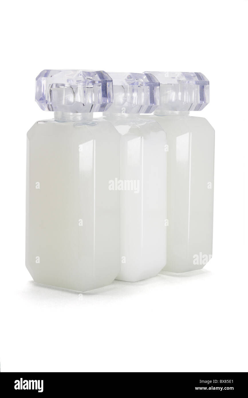 Three glass bottles of toiletries on white background Stock Photo
