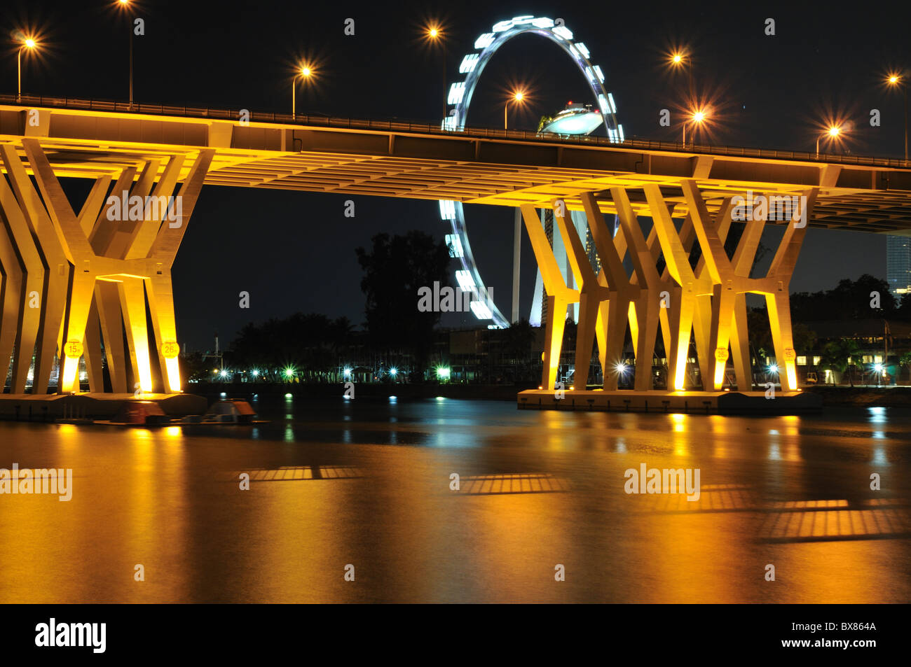 The Benjamin Sheares Bridge spanning the Kallang River and overlooking the Singapore Flyer. Stock Photo