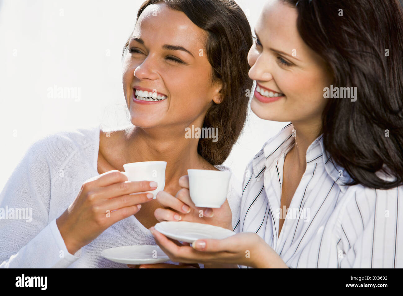 Female hands holding cups hi-res stock photography and images - Alamy